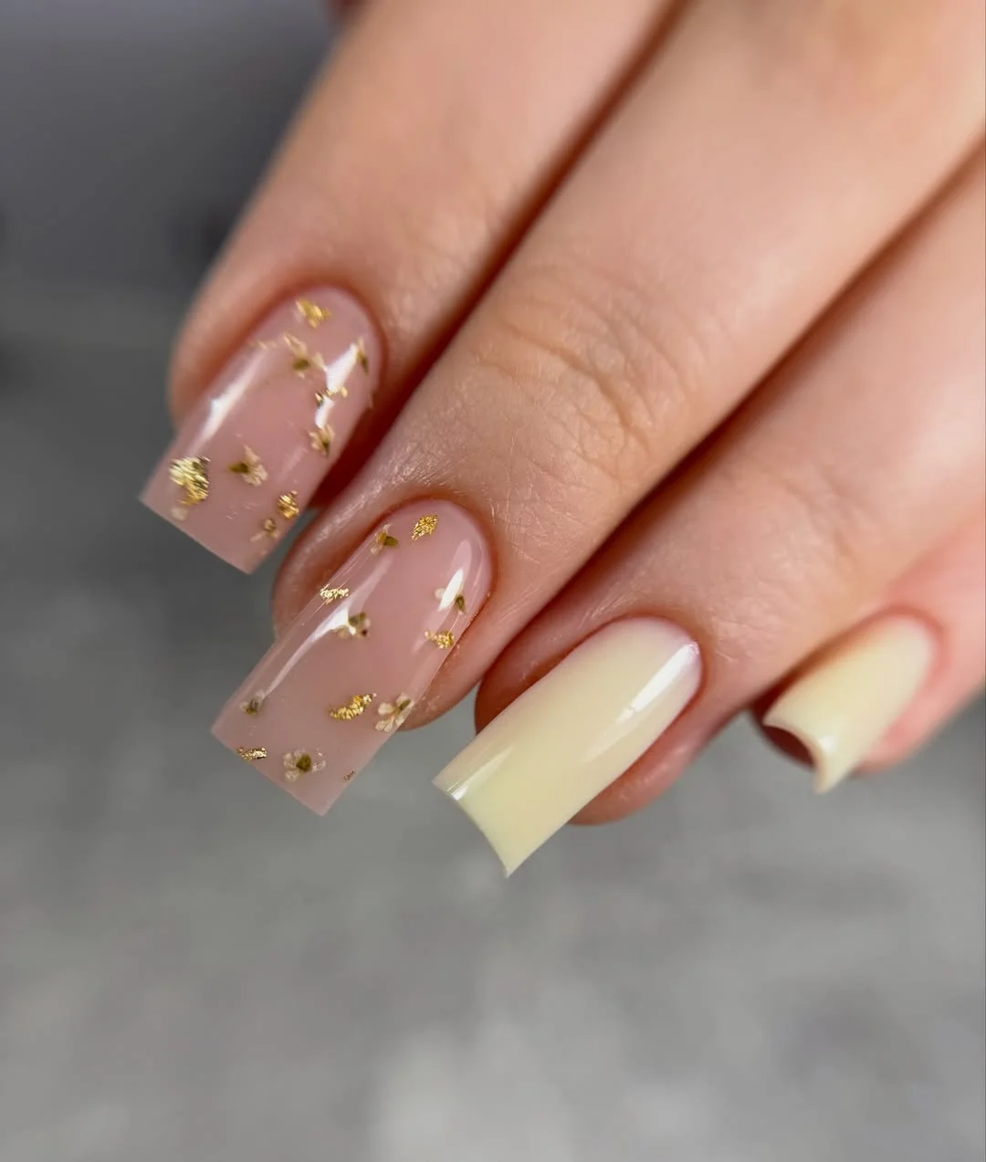 summer manicure color ideas 2026 Soft Vanilla Nails With Gold Foil Floral Details