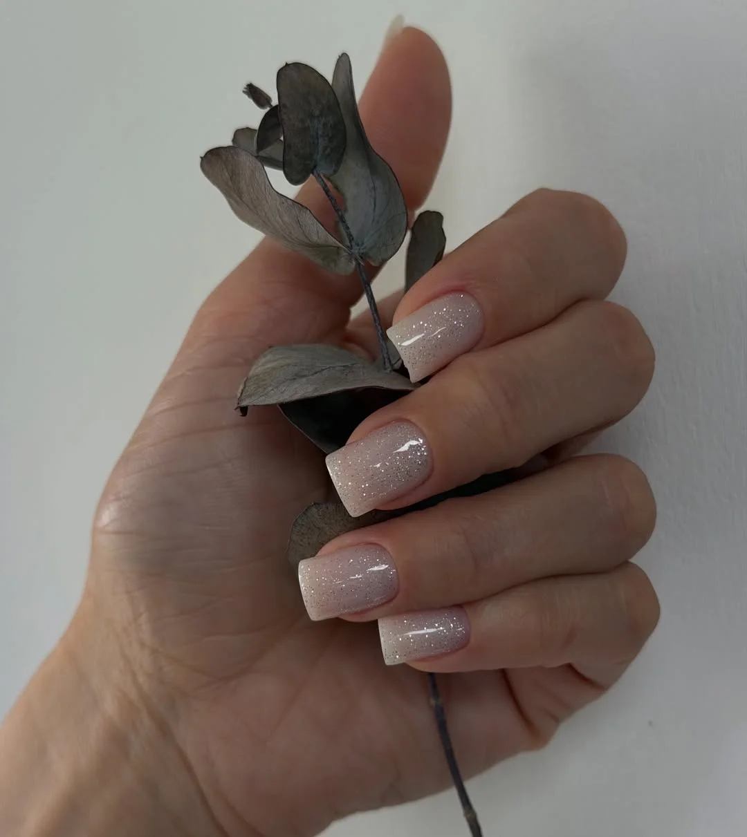 summer nail art 2026 Soft Glitter Nude Nails That Glow in Natural Light