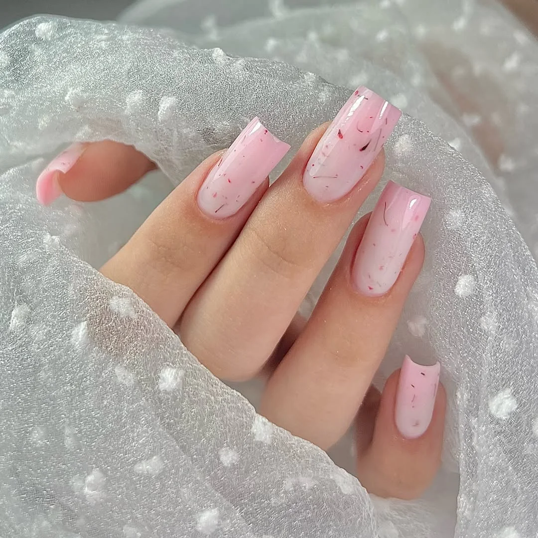 summer nail art 2026 Glossy Milky Pink Nails With Delicate Speckled Texture