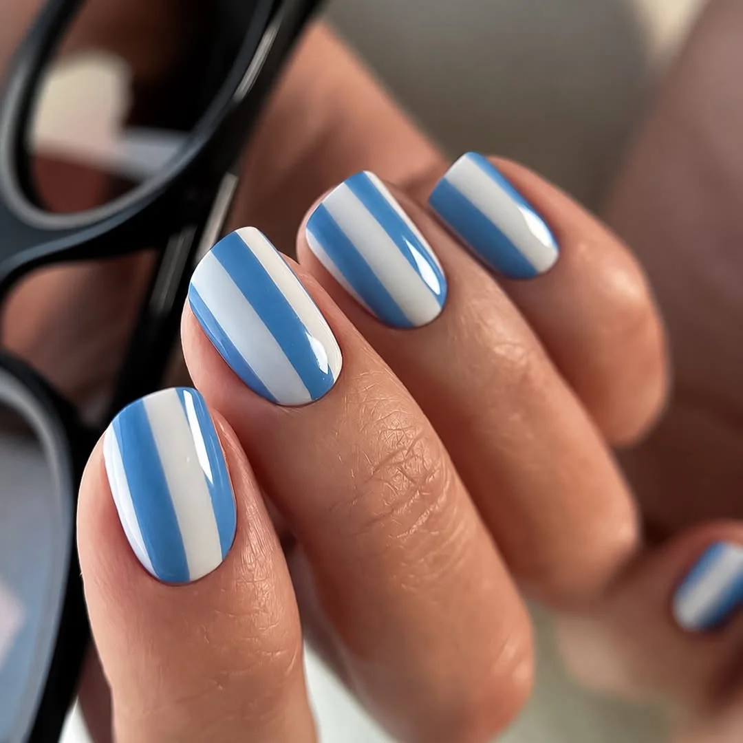 summer nail colors 2026 Blue And White Stripe Nails With Coastal Energy