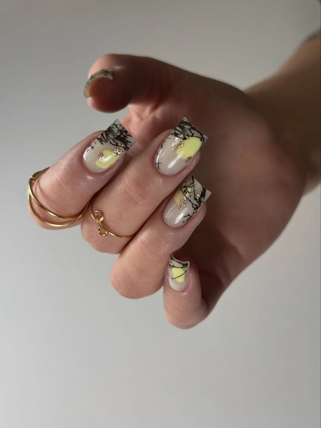 summer nail colors 2026 Abstract Neon Lemon Nails With Black Graphic Details