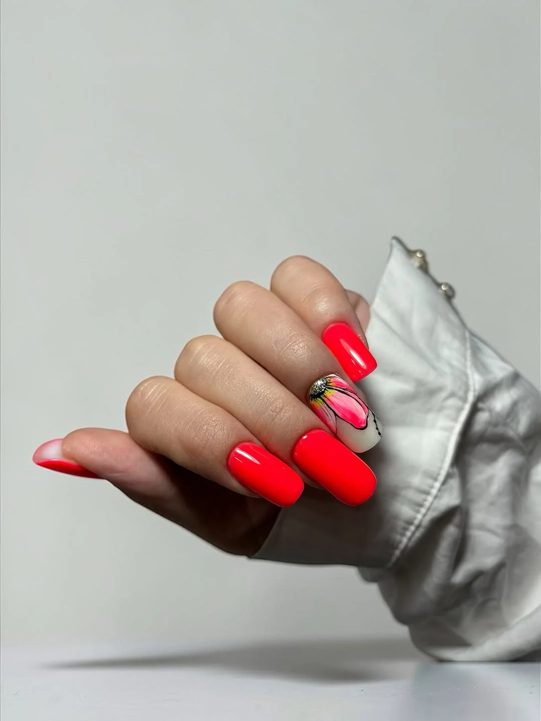summer nail inspo 2026 Hot Neon Coral Nails With Bold Butterfly Art