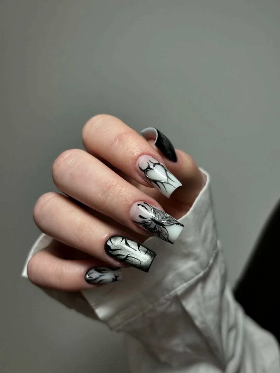 summer nail inspo 2026 Black and White Floral Nails With Editorial Summer Drama
