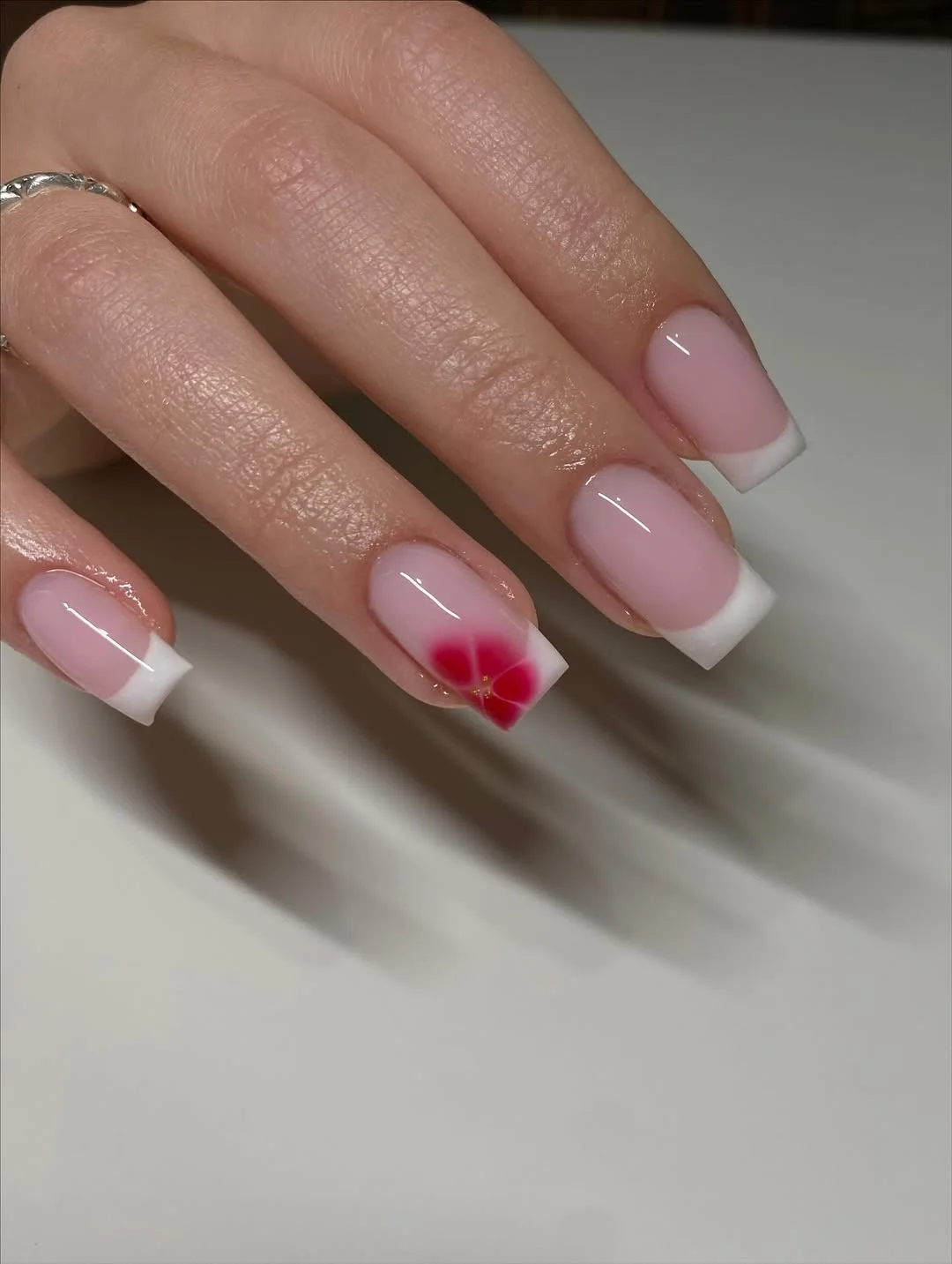 summer nails square 2026 Soft Pink French Nails With A Tiny Tropical Flower