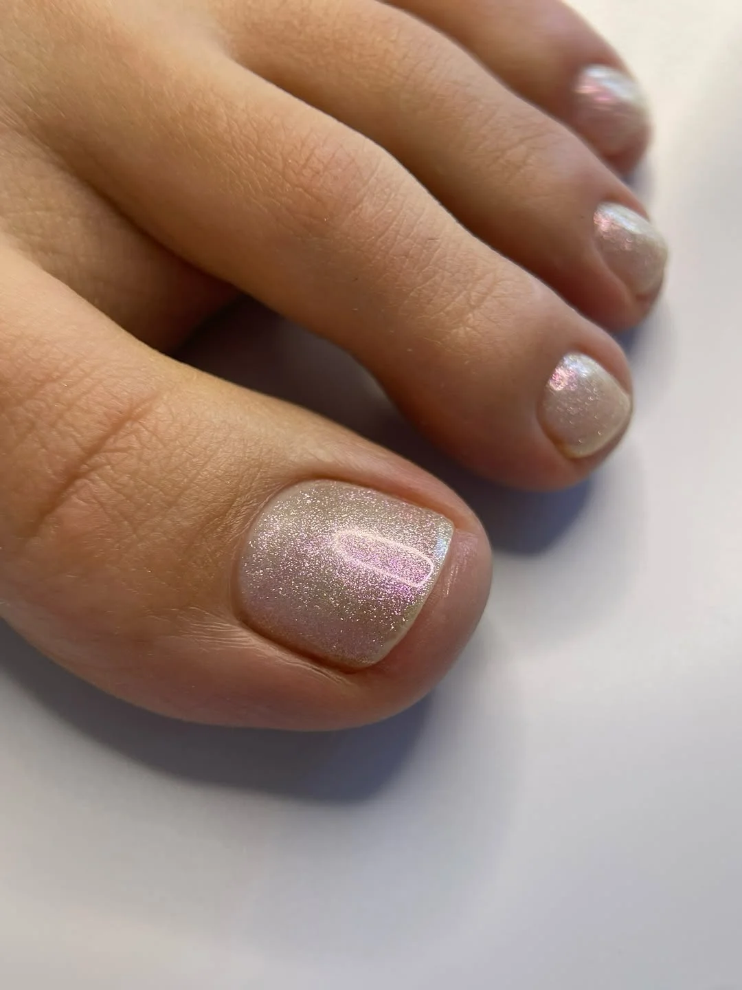 summer toe nails colors 2026 Shimmering Pearl Chrome Toes With a Glassy Finish