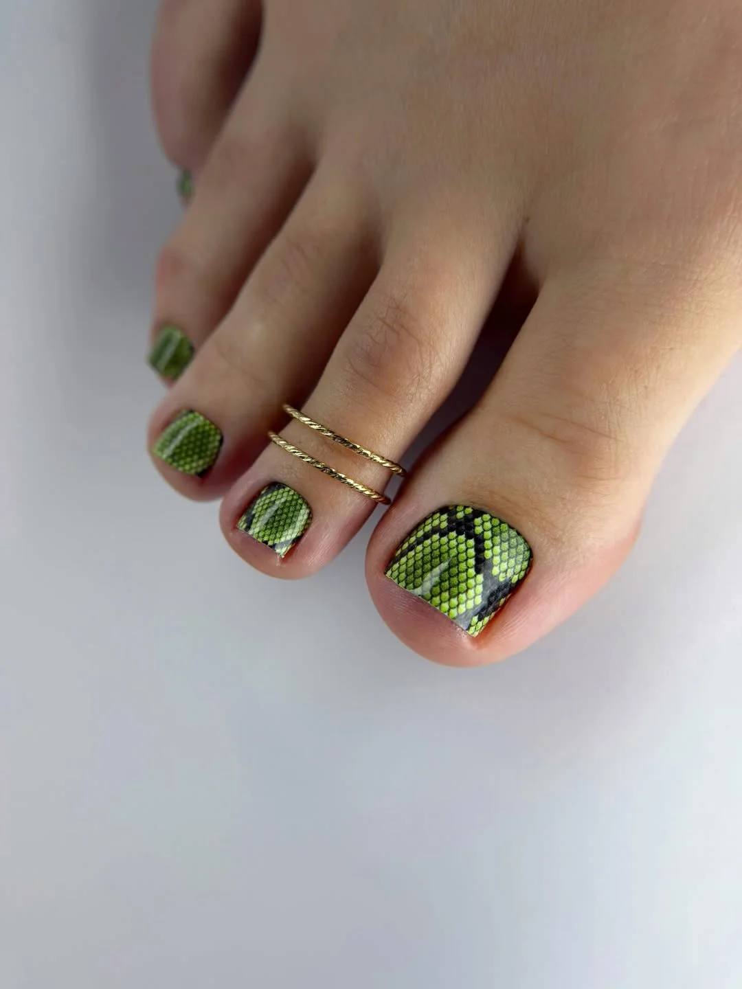 summer toe nails colors 2026 Wild Green Snake Print Toes for Bold Summer Energy