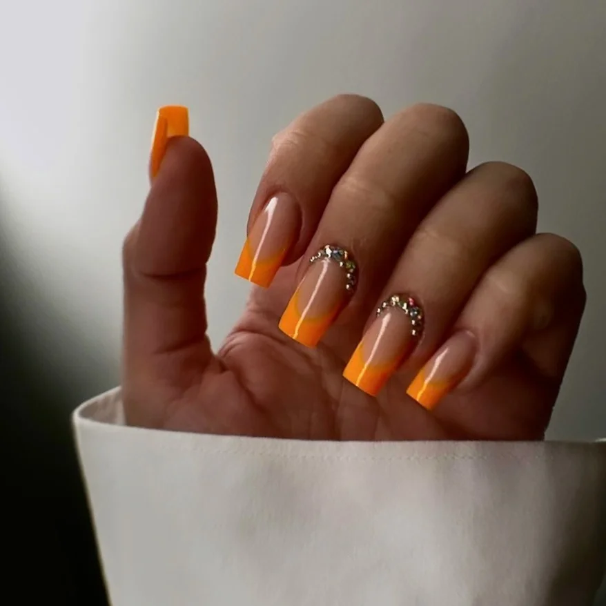 summer vibrant nails summer 2026 Orange French Tip Nails With Glossy Sunset Glow