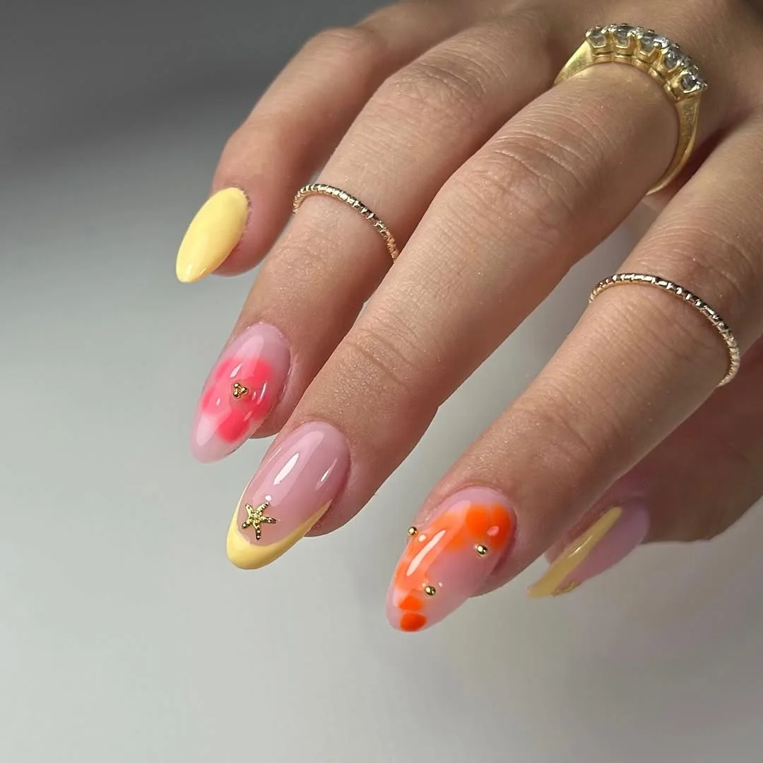 summer vibrant nails summer 2026 Soft Tropical Floral Nails With Sunset Orange Details