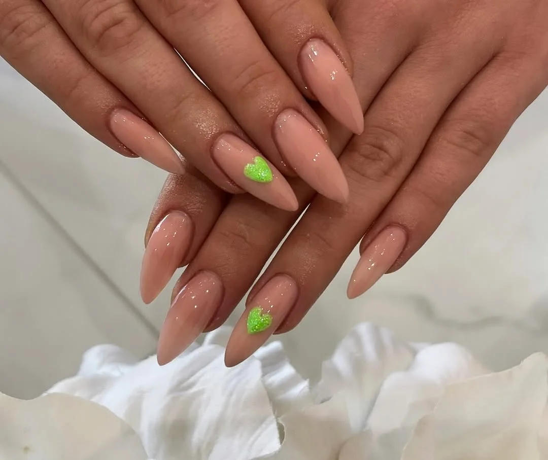 summer vibrant nails summer 2026 Nude Glossy Nails With Tiny Neon Heart Details