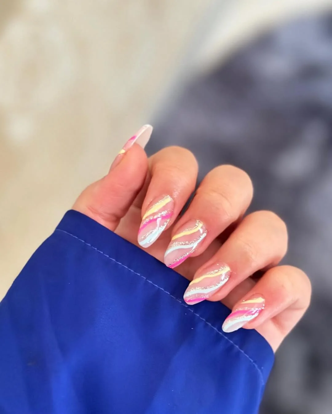 summer vibrant nails summer 2026 Pastel Rainbow Swirl Nails With Silver Glitter Waves