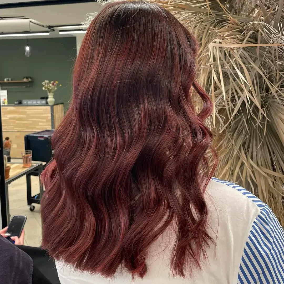 sun-kissed summer auburn hair color 2026 Velvety Auburn Waves with Rich Dimension