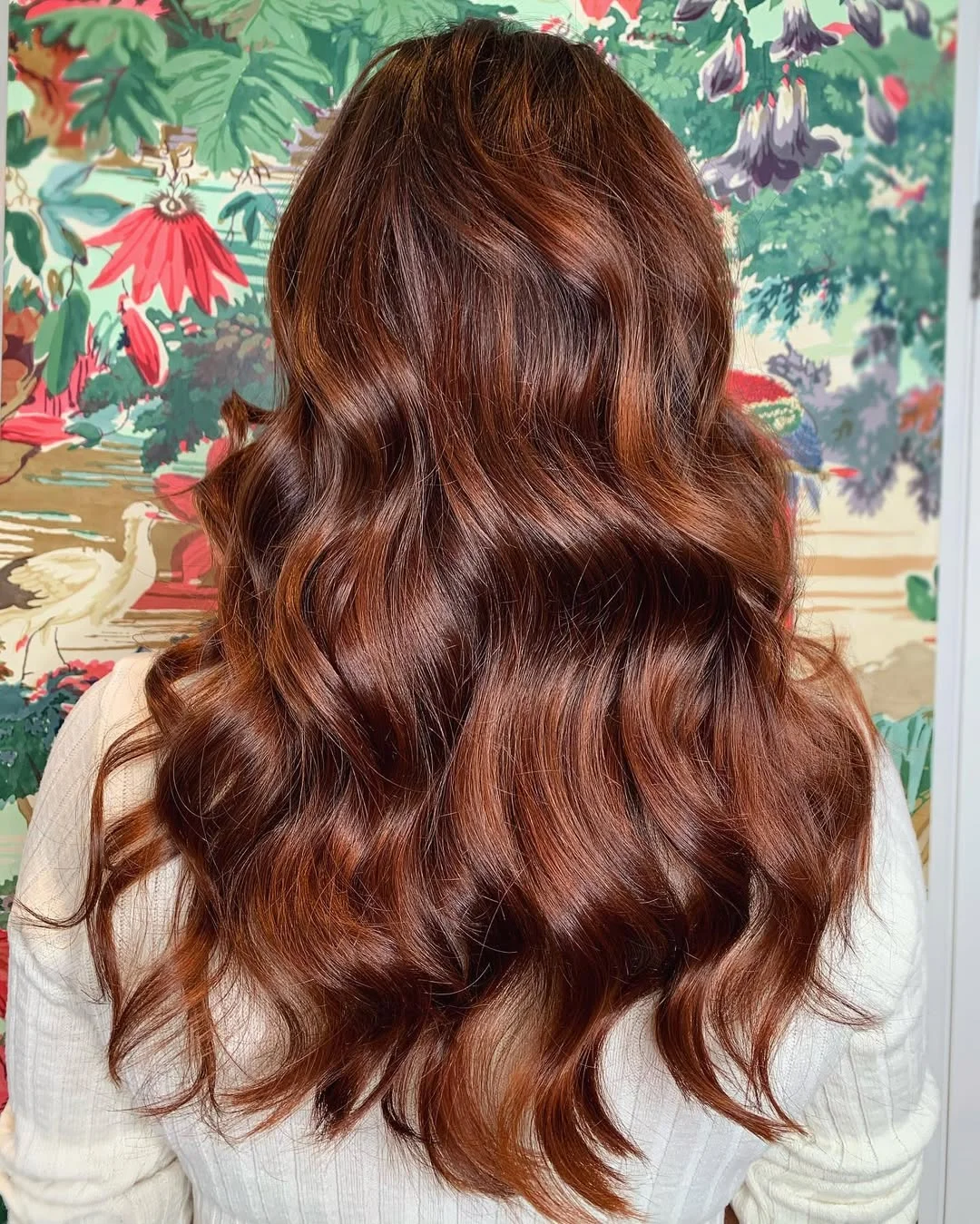 sun-kissed summer auburn hair color 2026 Chocolate Auburn Waves with Luminous Highlights