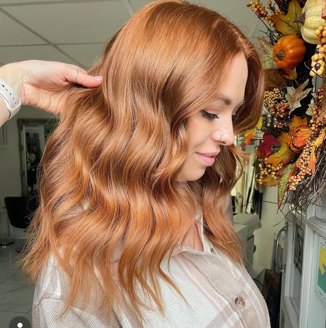 sun-kissed summer auburn hair color 2026 Golden Peach Auburn with Soft Blonde Undertones