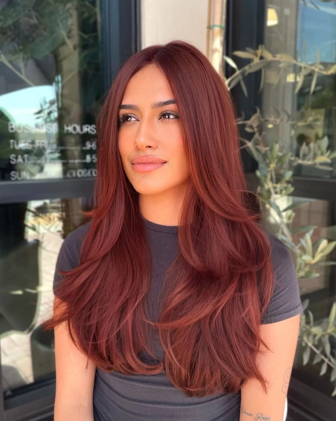 sun-kissed summer auburn hair color 2026 Deep Cherry Auburn Layers with Sculpted Volume