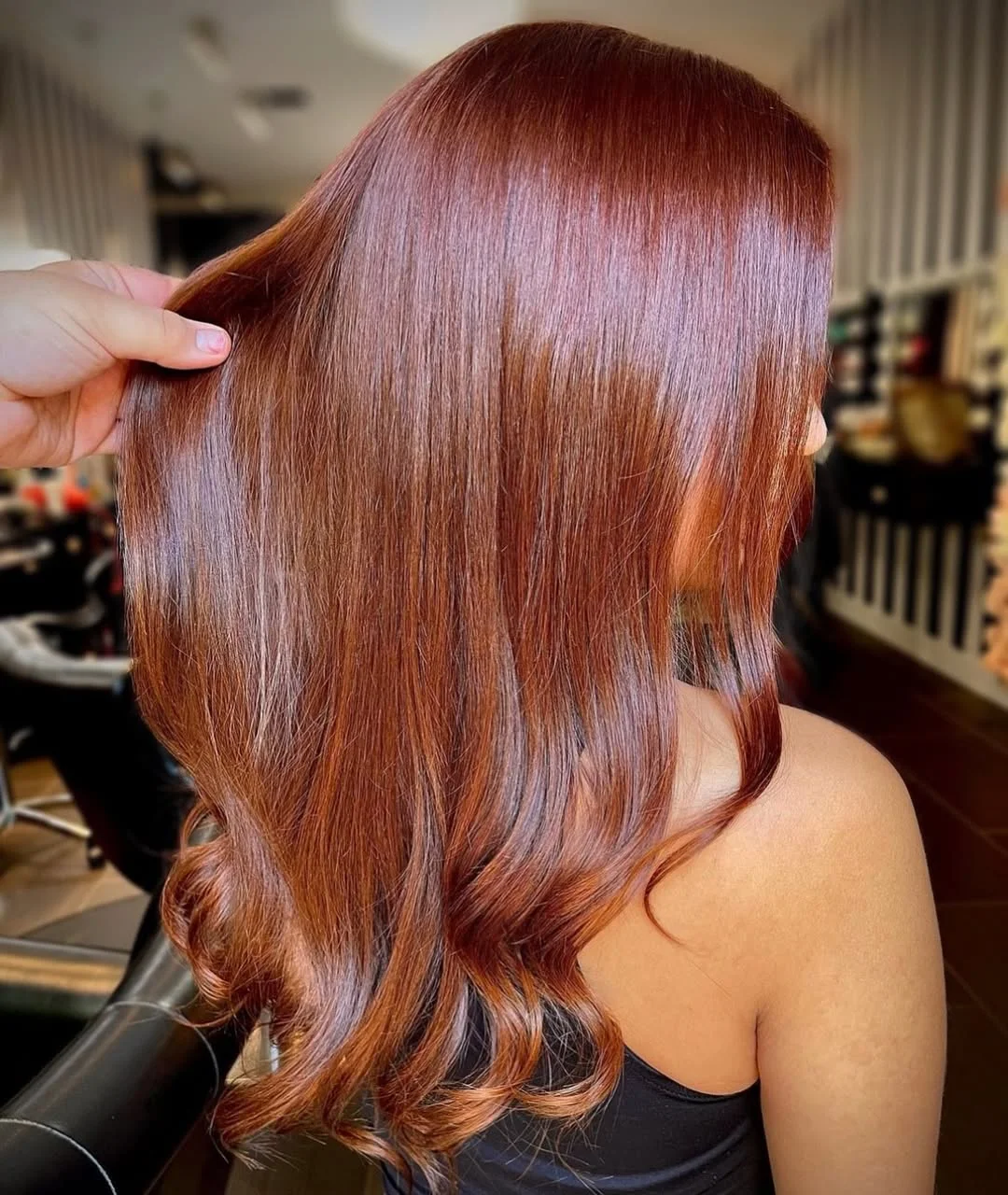 sun-kissed summer auburn hair color 2026 Classic Auburn Silk with Subtle Blonde Undertones