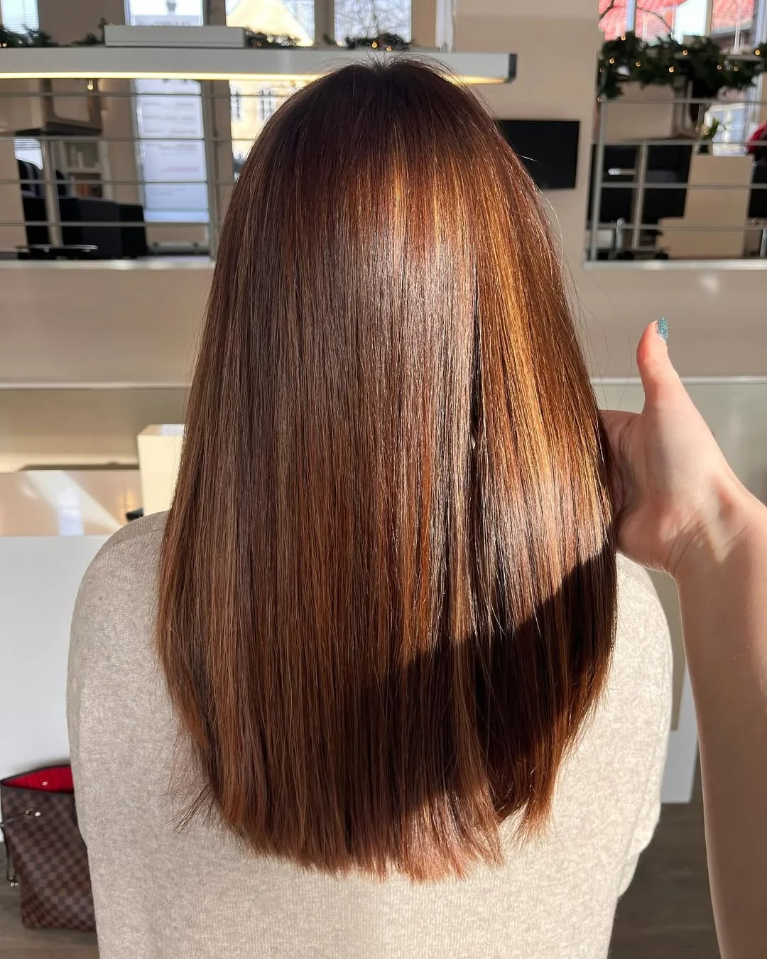 sun-kissed summer auburn hair color 2026 Sunlit Auburn Glass Hair with Subtle Dimension