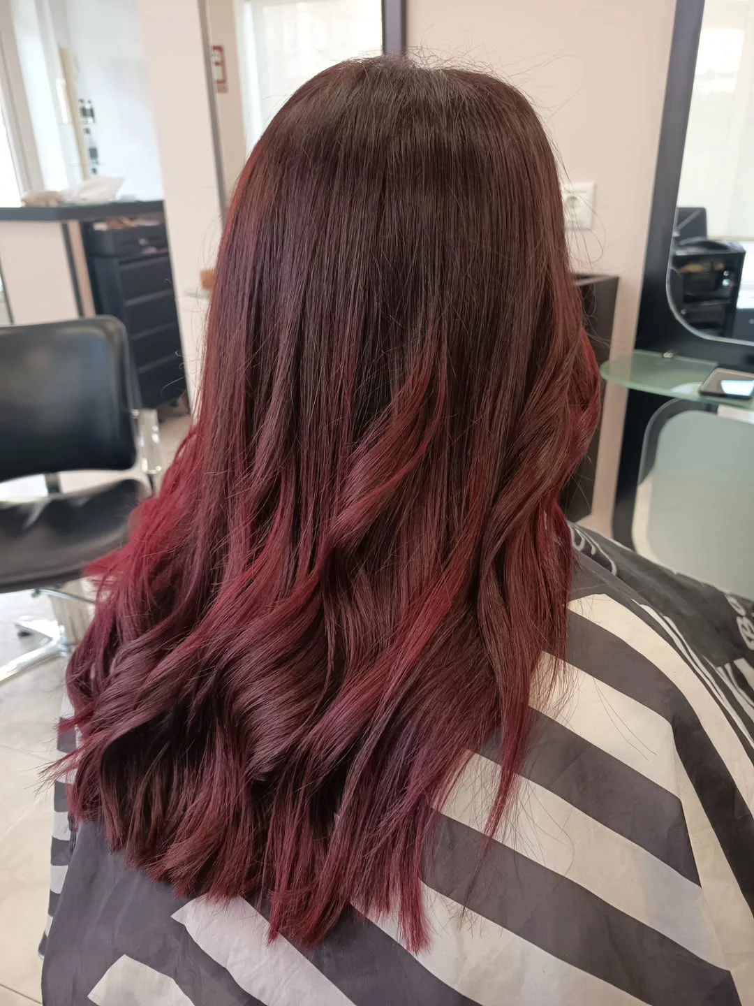 timeless summer haircuts for women over 40 2026 Deep Burgundy Waves With Modern Texture