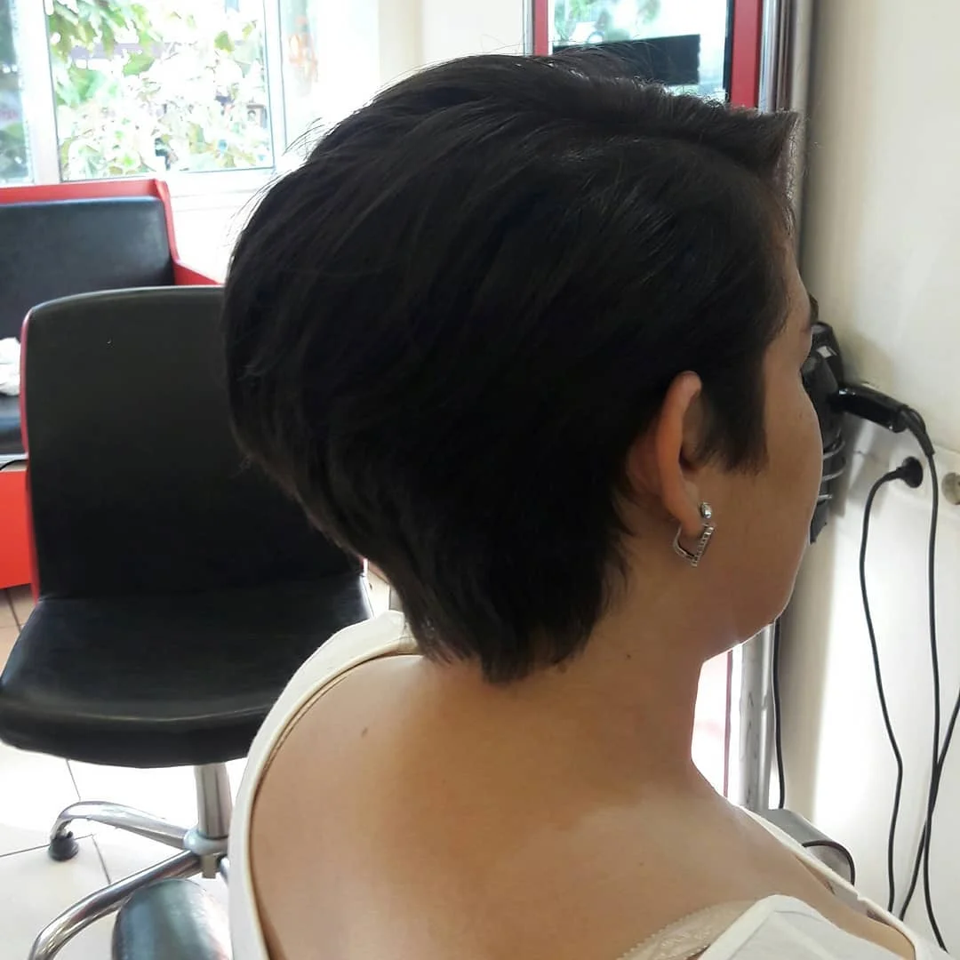 timeless summer haircuts for women over 40 2026 Classic Dark Pixie Bob With Tapered Layers