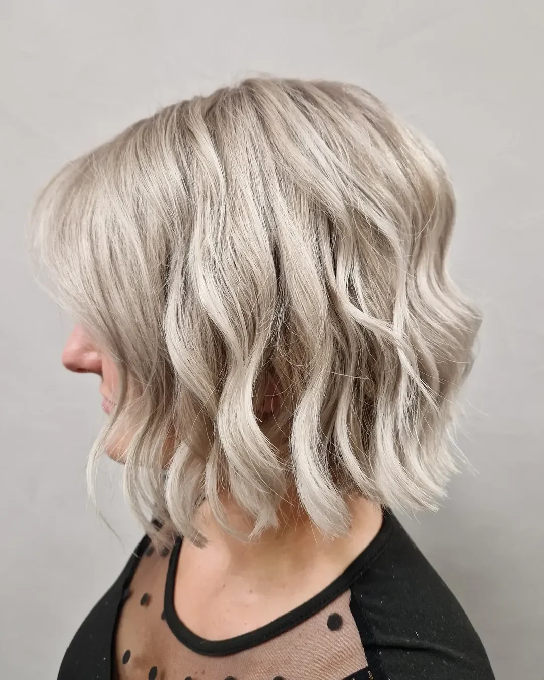 timeless summer haircuts for women over 40 2026 Textured Platinum Wavy Bob