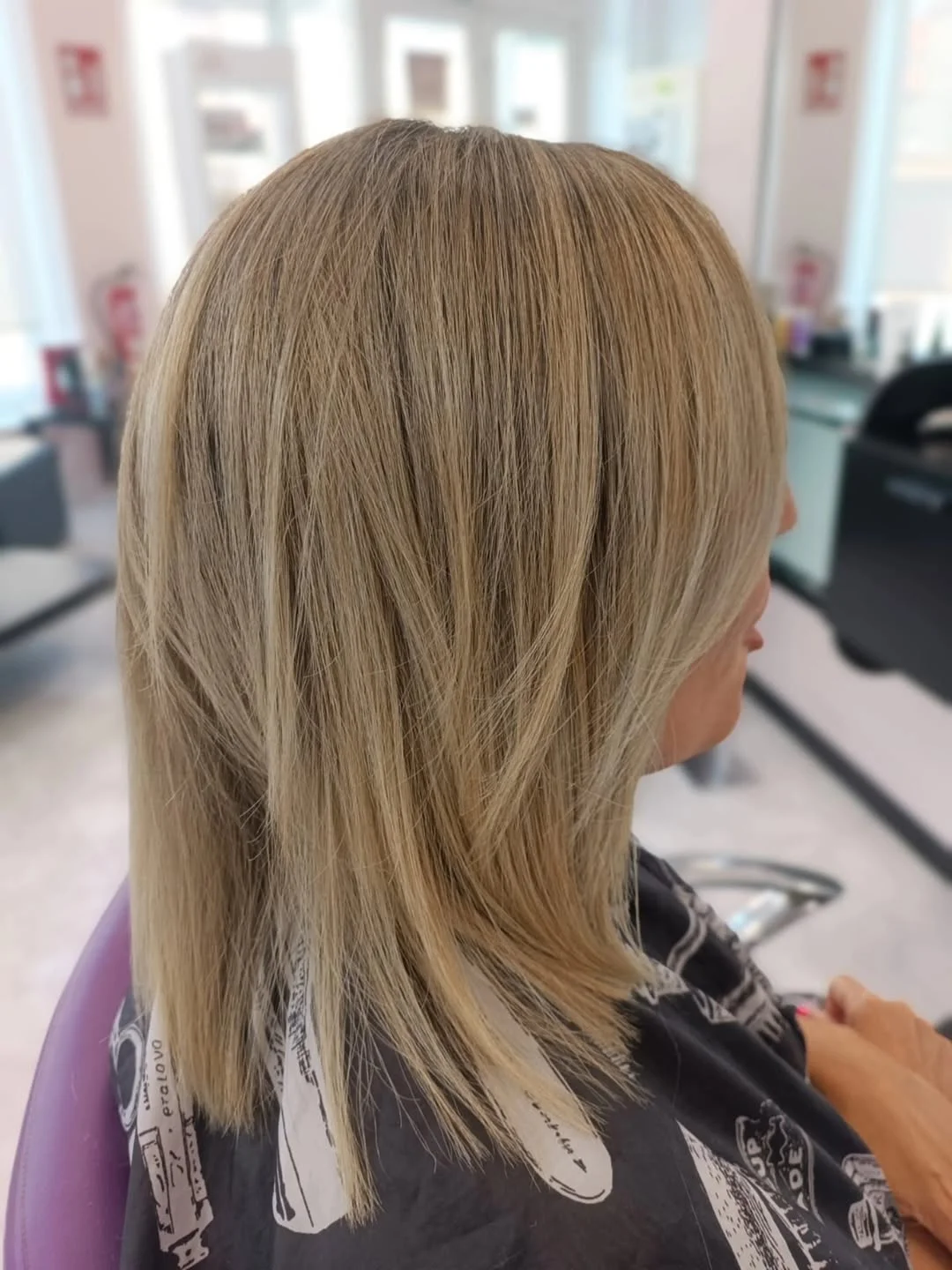 timeless summer haircuts for women over 40 2026 Soft Feathered Blonde Layers With Natural Movement