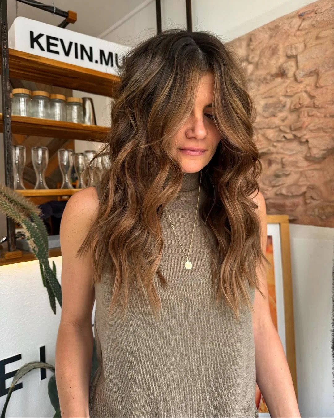 toffee summer hair color for tan skin 2026 Sunlit Toffee Brunette With Lived-In Waves