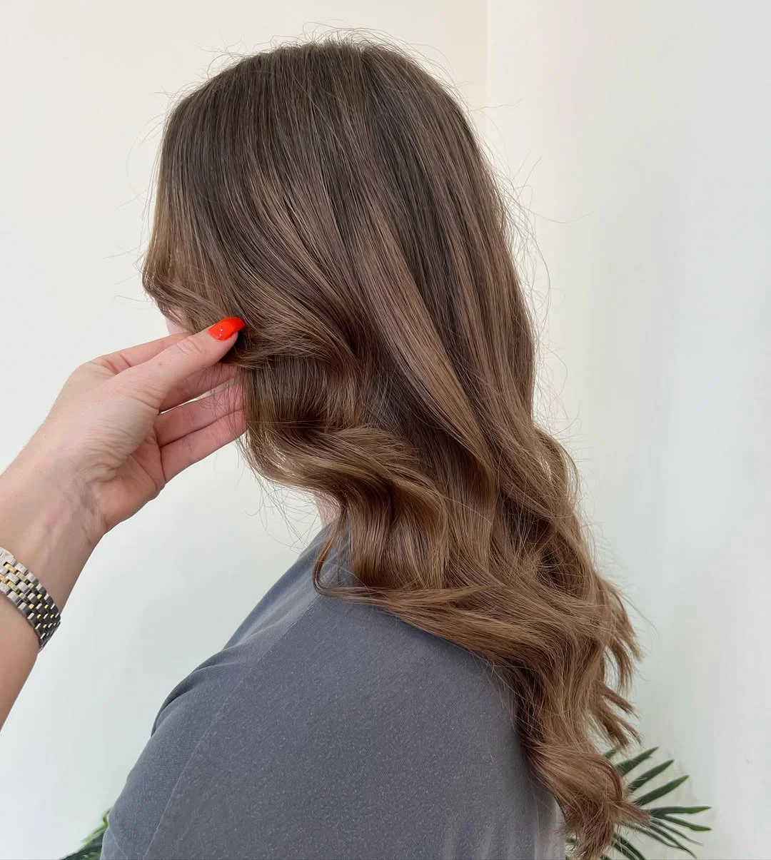 toffee summer hair color for tan skin 2026 Muted Toffee Brunette With Soft Velvet Waves