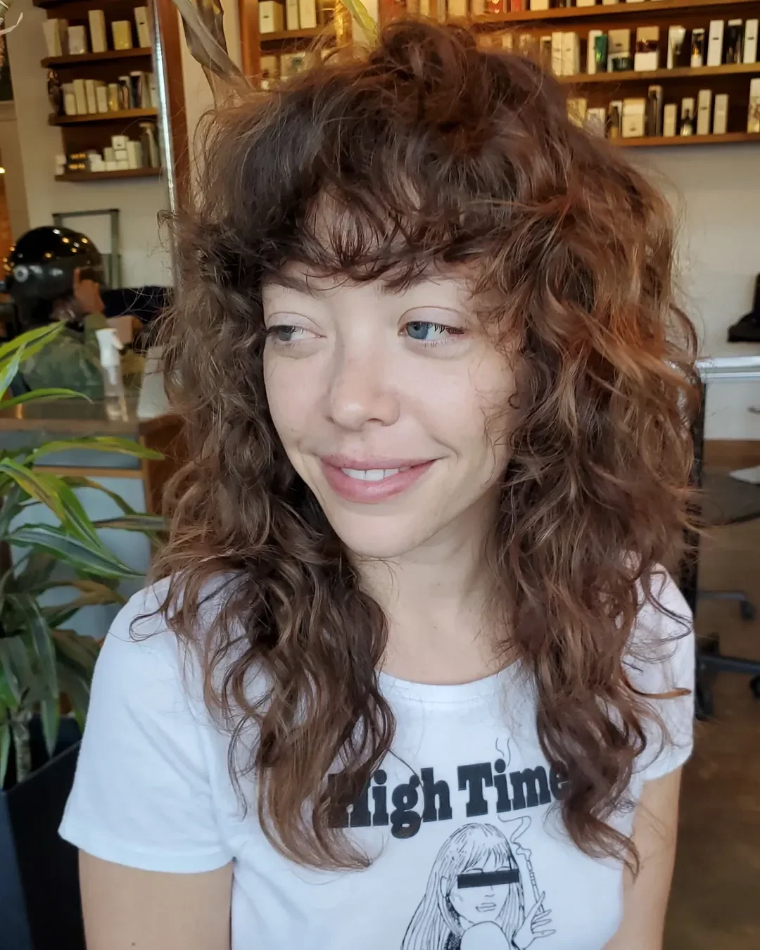 voluminous summer shag hairstyle 2026 Curly Shag with Playful Volume and Fringe