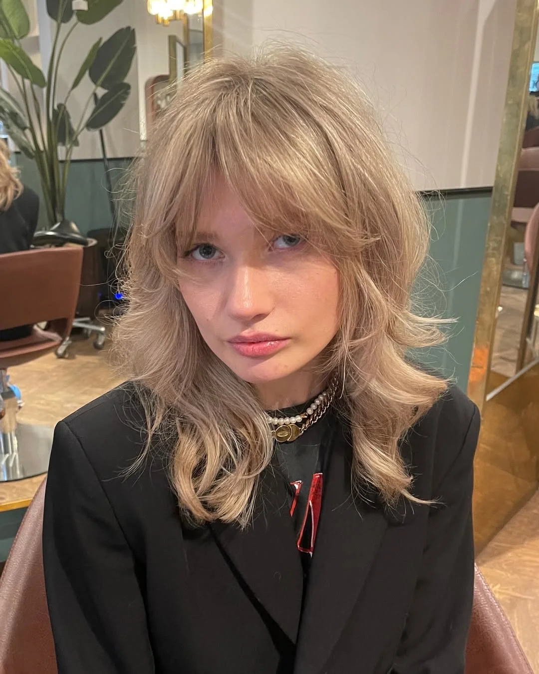 voluminous summer shag hairstyle 2026 Layered Blonde Shag with Curtain Bangs