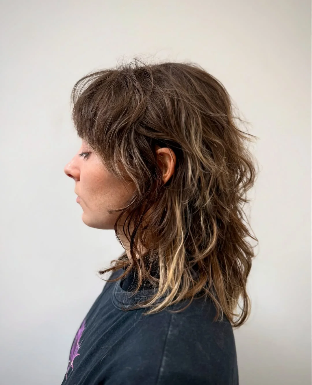 voluminous summer shag hairstyle 2026 Textured Brunette Shag with Natural Waves