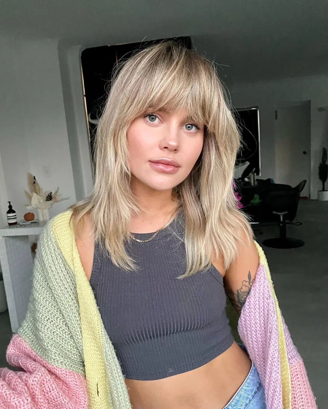 voluminous summer shag hairstyle 2026 Soft Platinum Shag with Feathered Ends